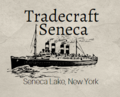 A logo for the Tradecraft Seneca company, with an image of a Great Lakes freighter